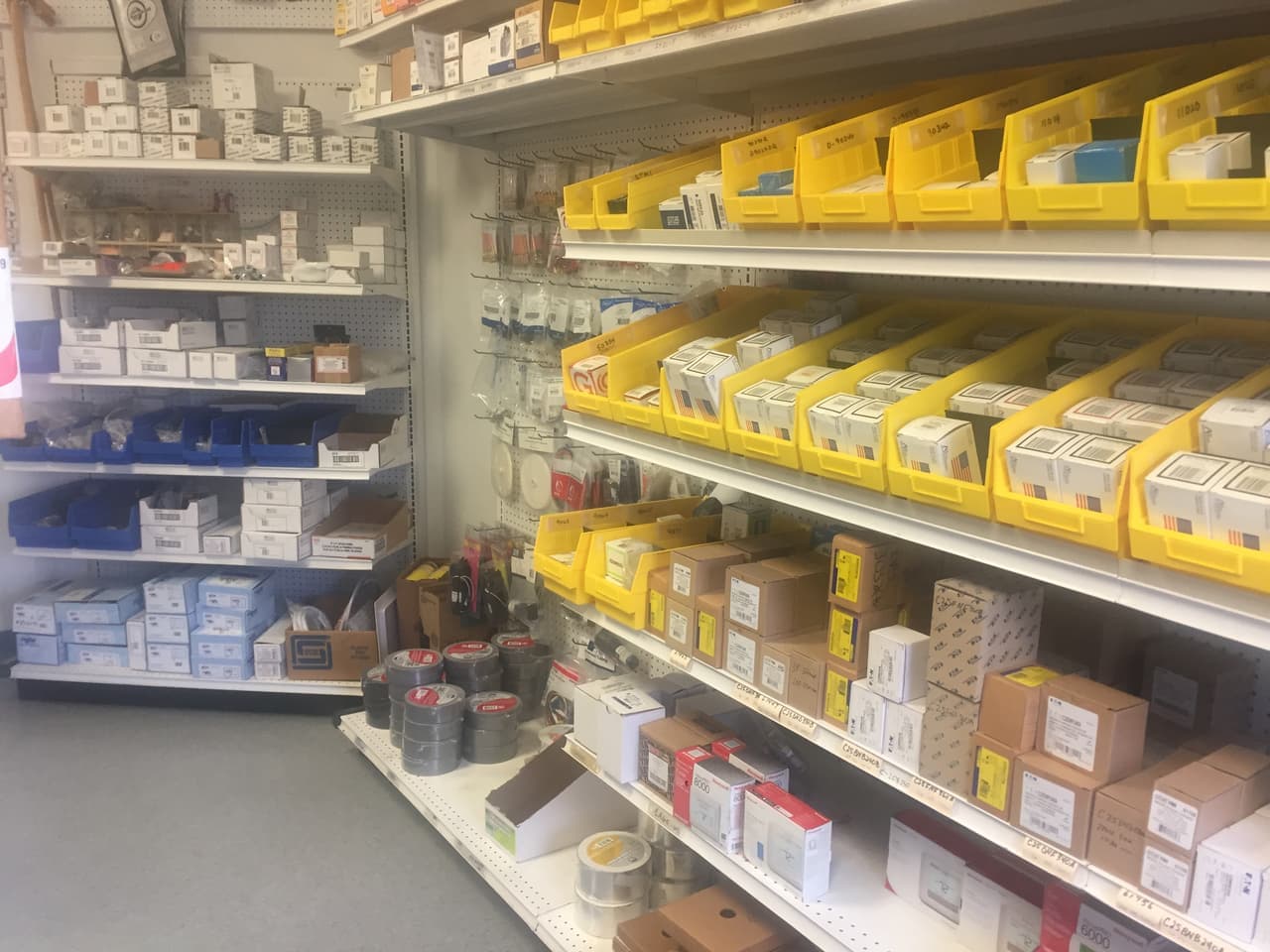 Shelves of thermostats, electrical controls and tape at Smith Supply in Stephenville, TX