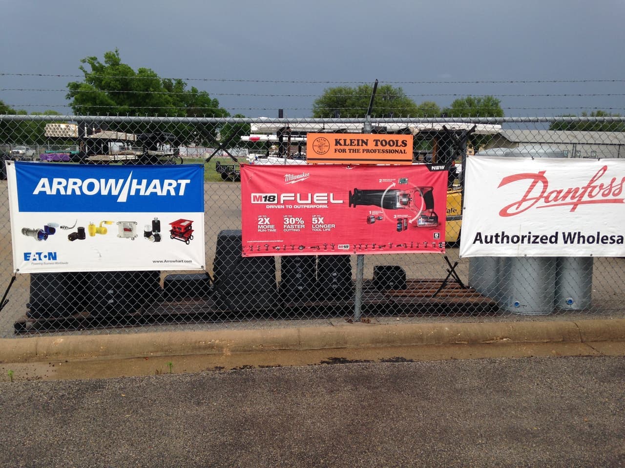 Vendor banners on the yard fence at Smith Supply in Stephenville, TX
