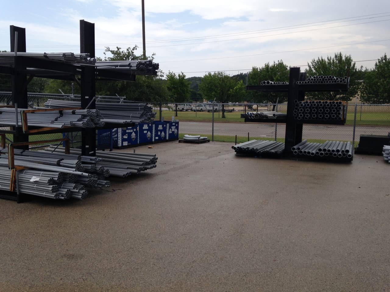 Outdoor racks of electrical conduit and pipe at Smith Supply in Stephenville, TX